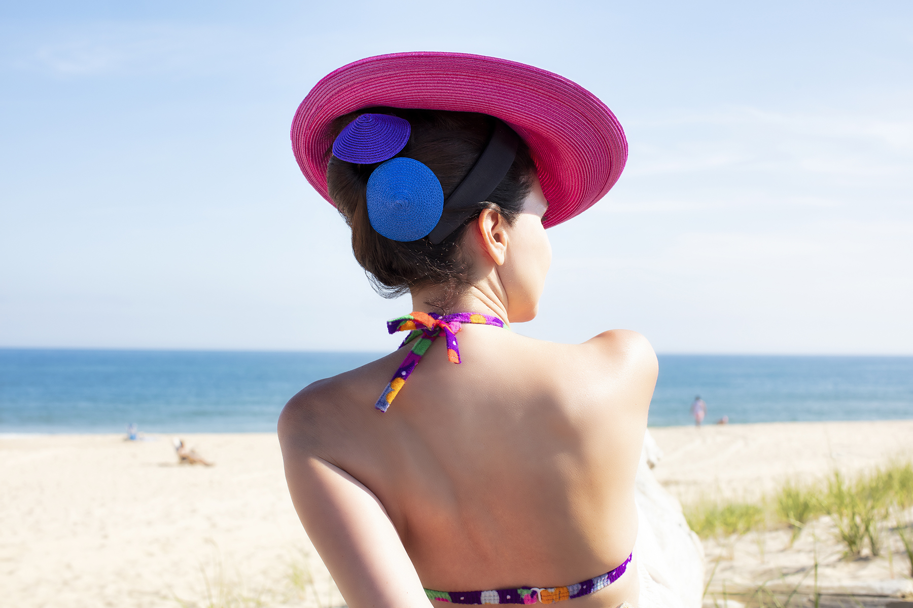 hair sticks and magenta pink hat